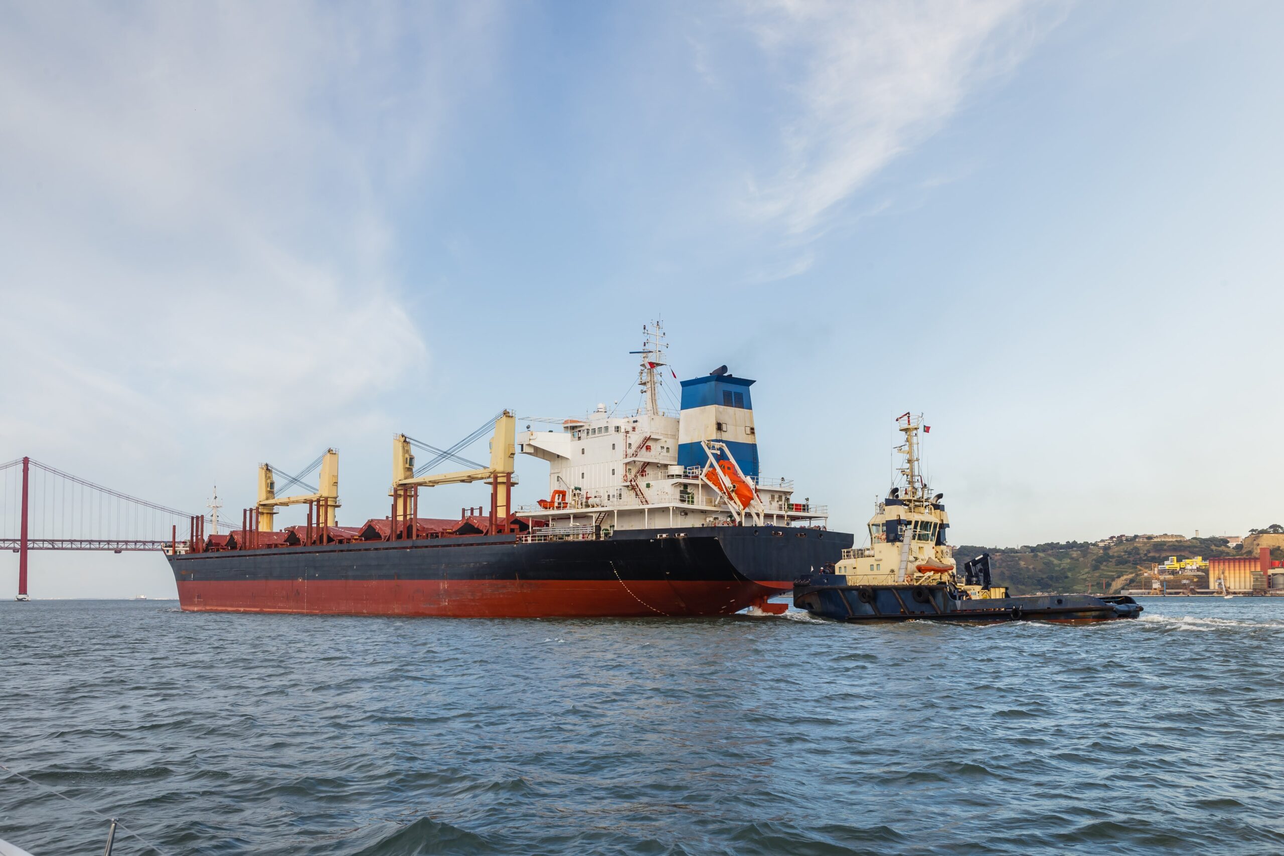 cargo-ships-in-river-being-tugged-2024-10-11-19-24-50-utc-min